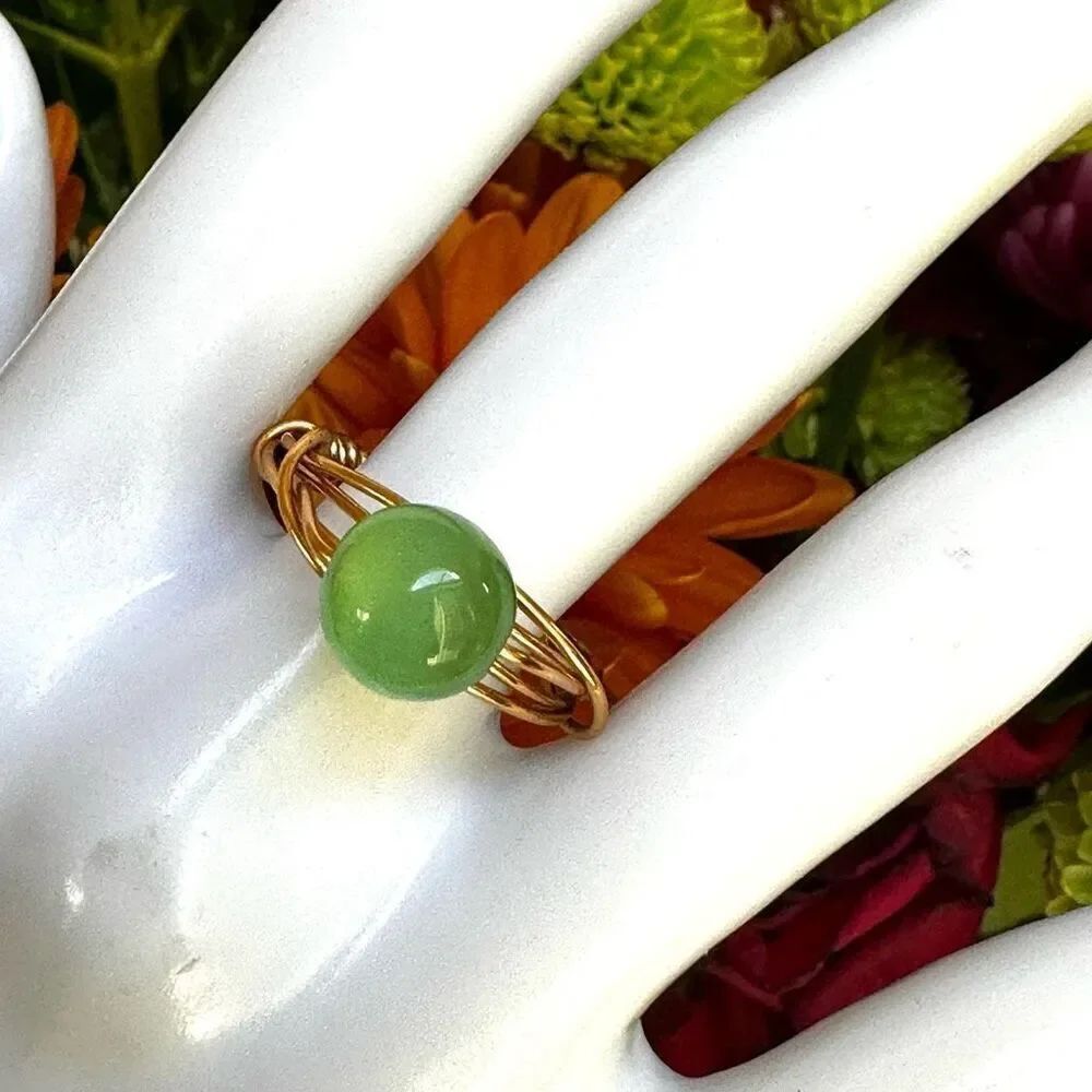 Gold tone green glow bead wire ring